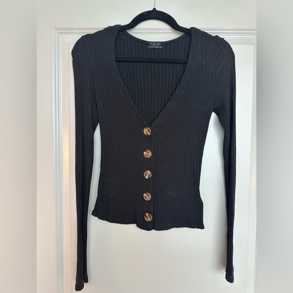 VICI black long sleeved shirt with brown buttons.